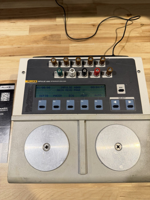 FLUKE IMPULSE 4000 DEFIB/PACER ANALYZER WITH CHARGER TESTED