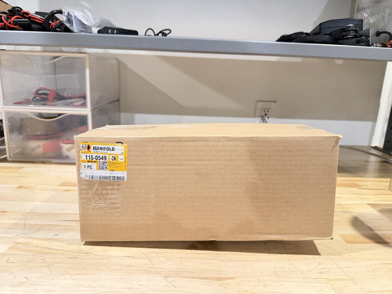 CAT 115-0549 EXHAUST MANIFOLD (NEW SEALED) SHIPS FREE