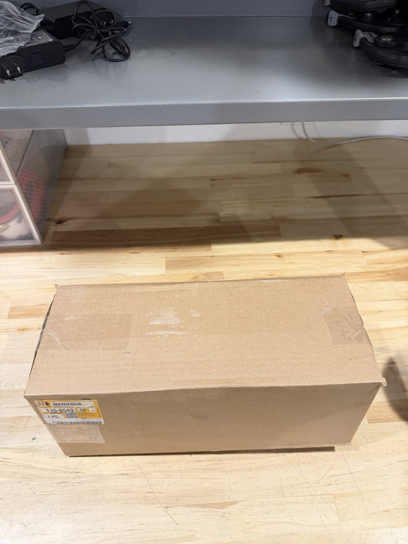 CAT 115-0549 EXHAUST MANIFOLD (NEW SEALED) SHIPS FREE