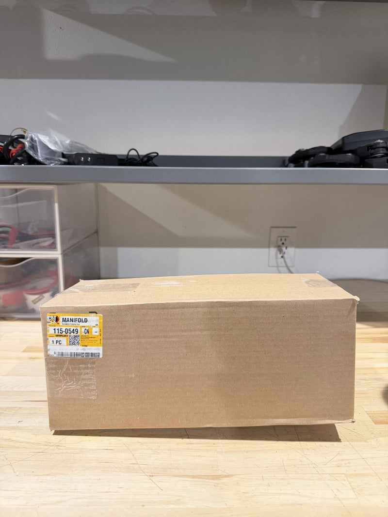 CAT 115-0549 EXHAUST MANIFOLD (NEW SEALED) SHIPS FREE
